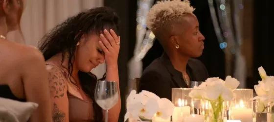 The Ultimatum: Queer Love stars Mildred and Mal around the table receiving the bad news.