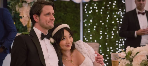 Queer non-binary actor Poppy Liu and Zach Woods as married couple in The Afterparty season 2.