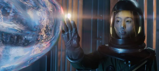 Mitsuki in astronaut suit touching alien in Invasion season 2.