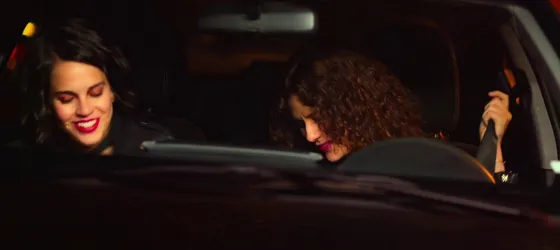 Alex and Gabriela in a car.