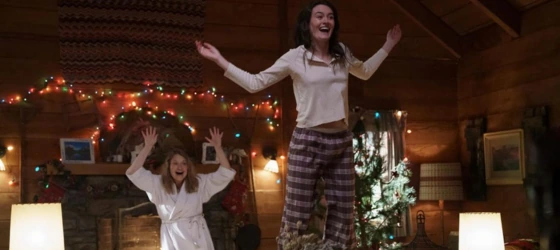 Sarah Pidgeon as young Clare and Merritt Wever celebrating Christmas.